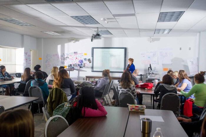 Woman teaching college class.