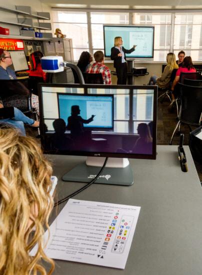 Woman teaching class about special education.